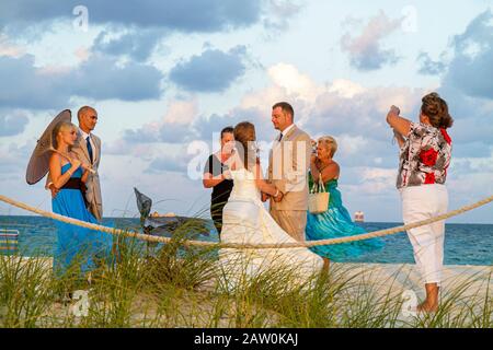 Miami Beach Florida,South Pointe Park,Point,wedding,ceremony,public beach beaches,vows,bride,bridegroom,guests,outside exterior,clouds,visitors travel Stock Photo