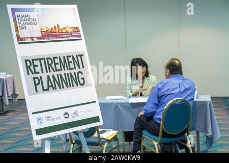 Miami Florida,James L. Knight Convention Center,Miami Financial Planning Day,free advice,guidanceal planners,sign,retirement planning,Asian woman fema Stock Photo