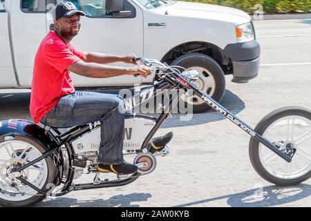Miami Beach Florida,5th Fifth Street,customized bicycle,bicycling,riding,biking,rider,imitation motorcycle,chopper,pedal,Black man men male,FL10100206 Stock Photo