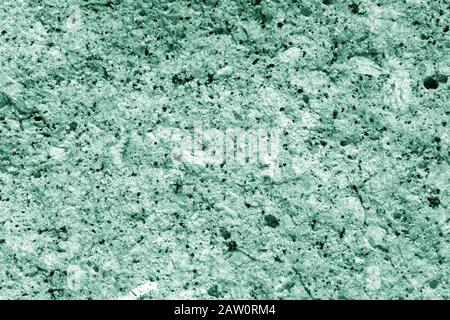 Seashore rocks texture close-up. Natural stone background green color toned Stock Photo
