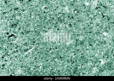 Seashore rocks texture close-up. Natural stone background green color toned Stock Photo