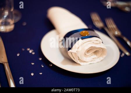 Beautiful Table Setting With Folded Napkin And Blooming Tree Branch On 