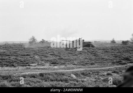 Queen Juliana and Prince Bernhard visited 4th Division of the Army. Tank in action. 'Wounded' is discharged Date: September 27, 1961 Keywords: royal visits, military, army units, tanks Stock Photo