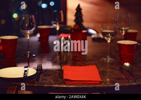 Dating at Night, Romantic Dinner Table Setting in a Restaurant decorated in Christmas Festival theme. Dating, Valentine, Festivals, Holidays, Seasons, Stock Photo