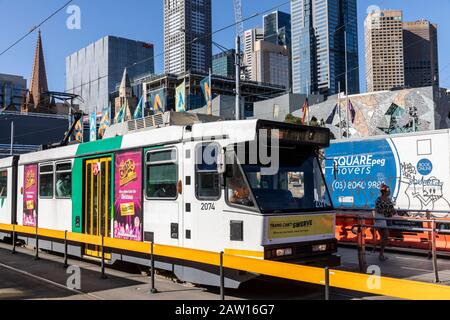Melbourne tram and melbourne skyscrapers in the city centre,Victoria,Australia summers day