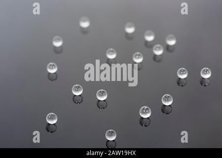 Abstract photo with small glass balls on transparent background. Stock Photo