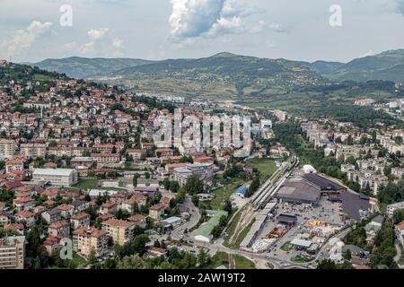 Bird's eye view of Sarajevo railway station, and the nova Sarajevo buildings, surrounded by the  mountains.Urban view. Stock Photo