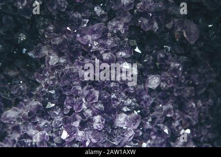 Close-up or macro of a lilac or violet mineral of amethyst druse Stock Photo