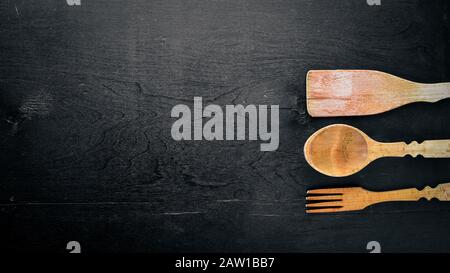 Kitchen tools. On Wooden background. Top view. Stock Photo