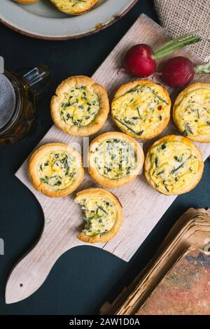 Mini quiches with wild asparagus and chives Stock Photo