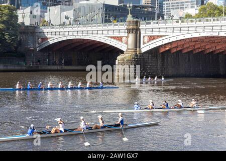 Teenage girls rowing crew on the yarra river in Melbourne city centre,Victoria,Australia summers day Stock Photo