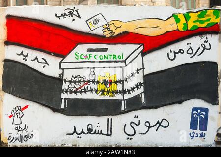 Egypt, Cairo, graffiti of the Egyptian revolution nearby Mohamed Mahmoud Street. It says elections are totally under the control of the army. Stock Photo