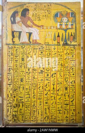 Cairo, Egyptian Museum, from the tomb of Sennedjem, Deir el Medina : Door panel (recto), Sennedjem following by his wife is playing the Senet game. Stock Photo