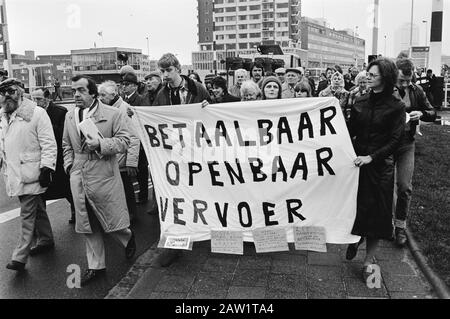 Demonstration in Rotterdam to increase fares for public transport under the slogan People will run before a stop, organized by VARA Ombudsman Frits Bom  Procession of protesters left Frits Bom Date: January 10, 1983 Location: Rotterdam, South Holland Keywords: demonstrations, wage and price policy, ombudsmen, public transport, banners Person Name: Bom, Frits Institution Name: Ombudsman Stock Photo