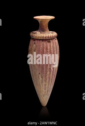 Minoan stone bottle with carved fluted decoration, Zakros 1500-1400 BC; Heraklion Archaeological  Museum, black background.. Stock Photo