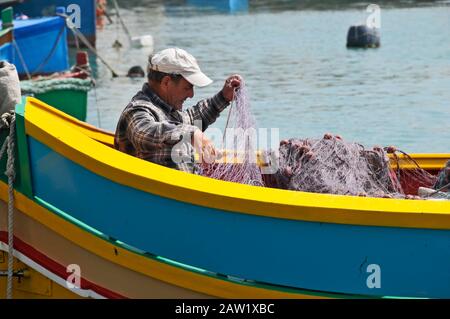 Around Malta - Fishermen, Marsaxlokk Stock Photo