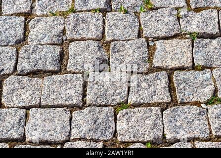 Background of cobblestones making from rough stone blocks Stock Photo