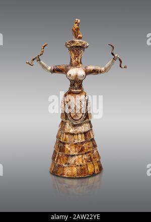 Minoan Snake Goddess statue arms raised holding 2 snakes from the  Knossos-Temple Repositories 1650-1550 BC, Heraklion Archaeological  Museum, grey ba Stock Photo