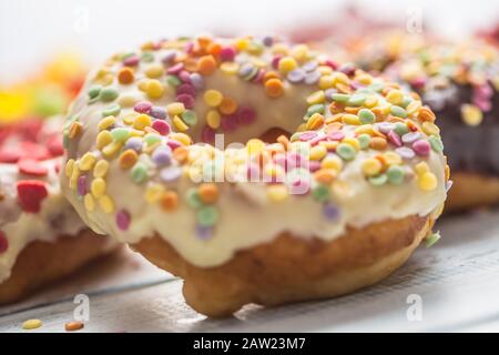 Sweet glazed donuts on table - Close up. Stock Photo