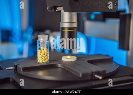 Science lab research safe of new drugs, microscope and pills coronavirus Stock Photo