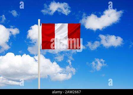 flag of Peru in front of blue cloudy sky, Peru Stock Photo