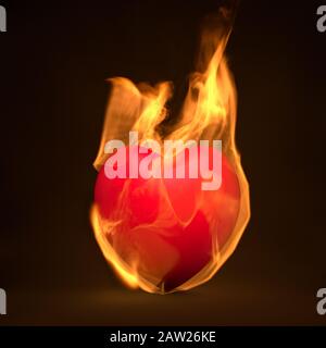 Red heart on fire, burning in flames, passion concept Stock Photo