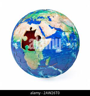 Globe jigsaw puzzle showing a piece missing over the continent of Africa on planet earth Stock Photo