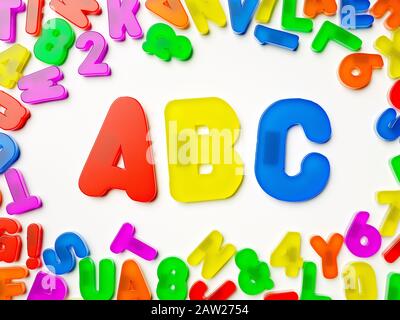 ABC plastic multi coloured fridge magnet alphabet spelling letters, education concept Stock Photo