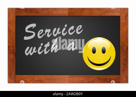 'Service with a Smile' written with chalk on a wooden frame blackboard Stock Photo