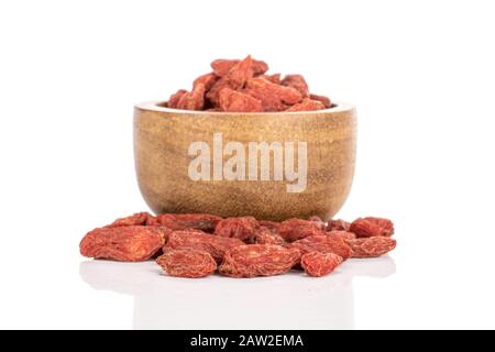 Lot of whole dried red goji berries in bamboo bowl isolated on white background Stock Photo