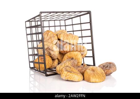 Lot of whole dried fig in black plastic basket isolated on white background Stock Photo