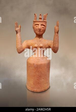 Minoan Postpalatial terracotta  goddess statue with raised arms,  Karphi Sanctuary 1200-1100 BC, Heraklion Archaeological Museum.   The Goddesses are Stock Photo