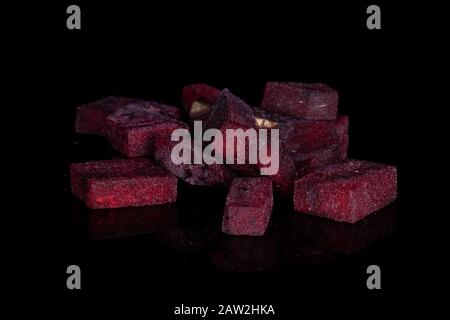 Lot of pieces of raw sweet beetroot isolated on black glass Stock Photo