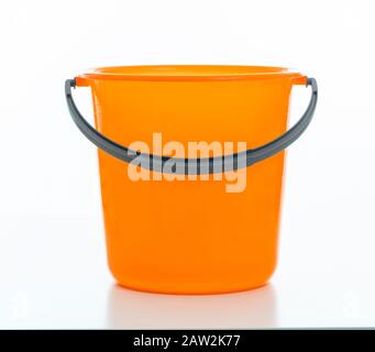 Cleaning bucket orange color isolated against white background, Domestic household cleaning Stock Photo