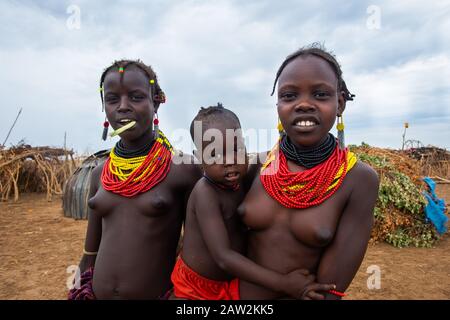 Omorate, Ethiopia - Nov 2018: Young woman of Dassanech tribe posing, waring tradition colorful necklaces. Omo valley Stock Photo