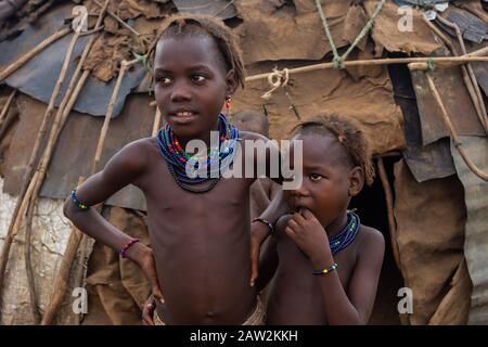 Omorate, Ethiopia - Nov 2018: Dasanech tribe kids wearing traditional clothes and necklaces Stock Photo