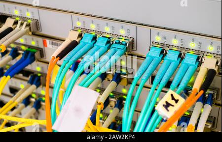 Optical links of high-speed Internet connection. Front panel of the main router of the network access provider. Primary Data Center Server Stock Photo