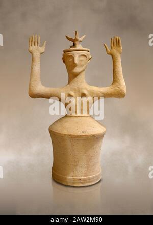 Minoan Postpalatial terracotta  goddess statue with raised arms and horn crown,  Karphi Sanctuary 1200-1100 BC, Heraklion Archaeological Museum.   The Stock Photo