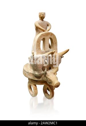 Minoan cult model of a 3 wheeled chariot drawn by a bull with a ...