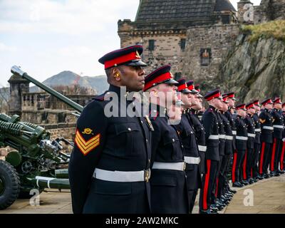 Edinburgh Castle, Edinburgh, Scotland, United Kingdom. 06th Feb, 2020. 21 Gun Salute: The salute by the 26 Regiment Royal Artillery marks the occasion of the Queen's accession to the throne on 6th February 1952, 68 years ago. Soldiers stand to attention Stock Photo