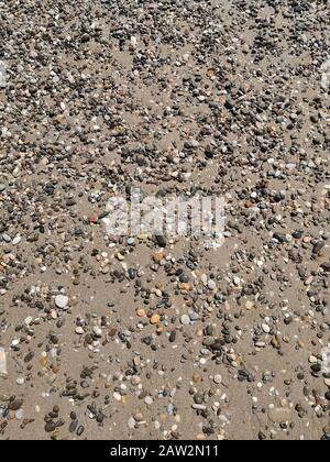 Background image: small sea pebbles on the beach Stock Photo