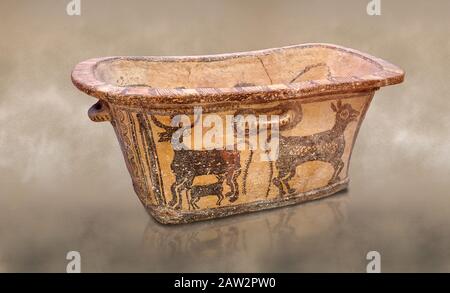 Minoan  pottery bath tub  larnax decorated with a cow nursing a calf,  Episkopi-Lerapetra 1350-1250 BC, Heraklion Archaeological  Museum.  To the Gree Stock Photo