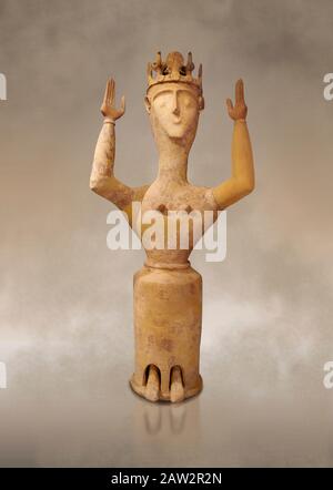 Minoan Postpalatial terracotta  goddess statue with raised arms and crown,  Karphi Sanctuary 1200-1100 BC, Heraklion Archaeological Museum.   The Godd Stock Photo