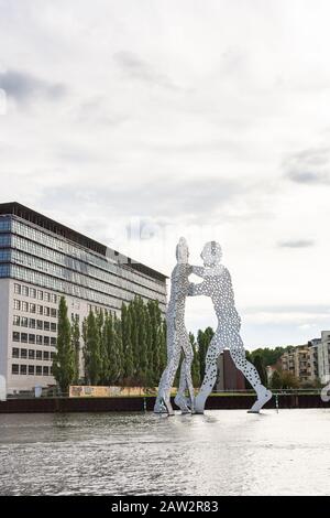 Berlin, Germany- October 6, 2019: view of the other shore from the Spree river embankment between the Oberbaunum bridge and Elsen Bridge, Molecule Man Stock Photo