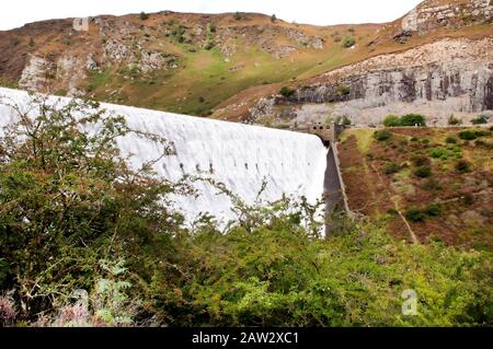 Overflowing dam at the Elan Valley after heavy rainfall. Stock Photo