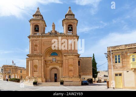 The beautiful view of a Roman Catholic parish church on the background of a blue sky. Stock Photo