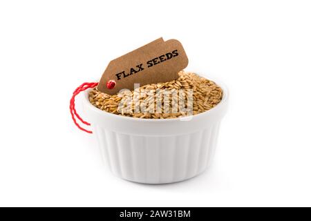 Golden flax seeds in white bowl isolated on white background Stock Photo