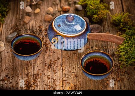 Chinese blue tea pot and tea cups on the wooden background Stock Photo