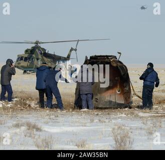 Russian Search and Rescue teams arrive at the Soyuz MS-13 spacecraft shortly after it landed in a remote area near the town of Zhezkazgan, Kazakhstan with Expedition 61 crew members Christina Koch of NASA, Alexander Skvortsov of the Russian space agency Roscosmos, and Luca Parmitano of ESA (European Space Agency) Thursday, Feb. 6, 2020. Koch returned to Earth after logging 328 days in space --- the longest spaceflight in history by a woman --- as a member of Expeditions 59-60-61 on the International Space Station. Skvortsov and Parmitano returned after 201 days in space where they served as Ex Stock Photo