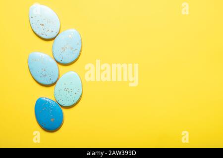 Easter cookies on a yellow background. Place for text. Easter eggs. Stock Photo